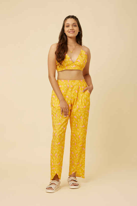 Model in Peela Sunshine Pants showcasing the comfortable back elastic for a perfect fit and the playful tulip hemline, exuding a dash of cheerfulness