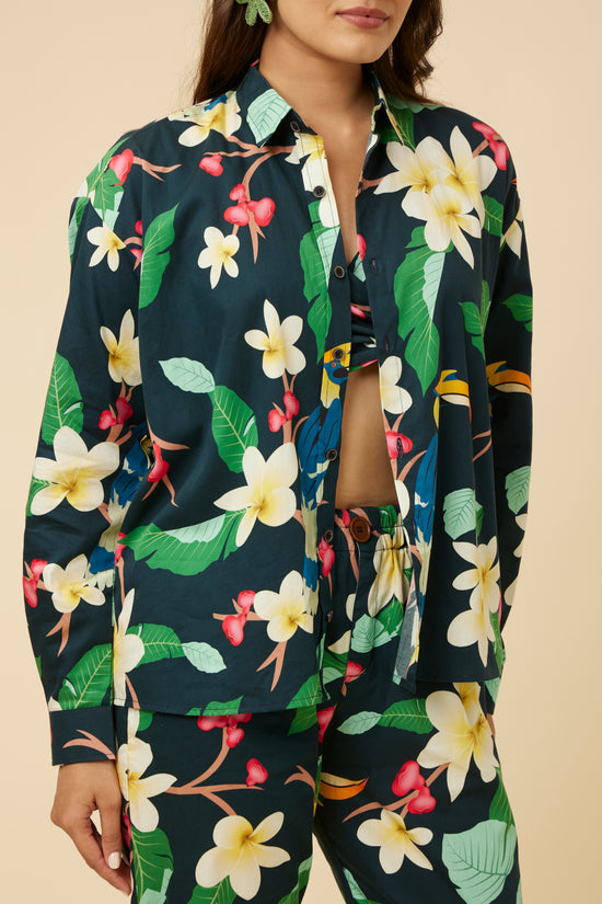 Model wearing Kaala Summery Full-Sleeve Shirt with a plumeria, rose apple, and hornbill print, front button closure visible
