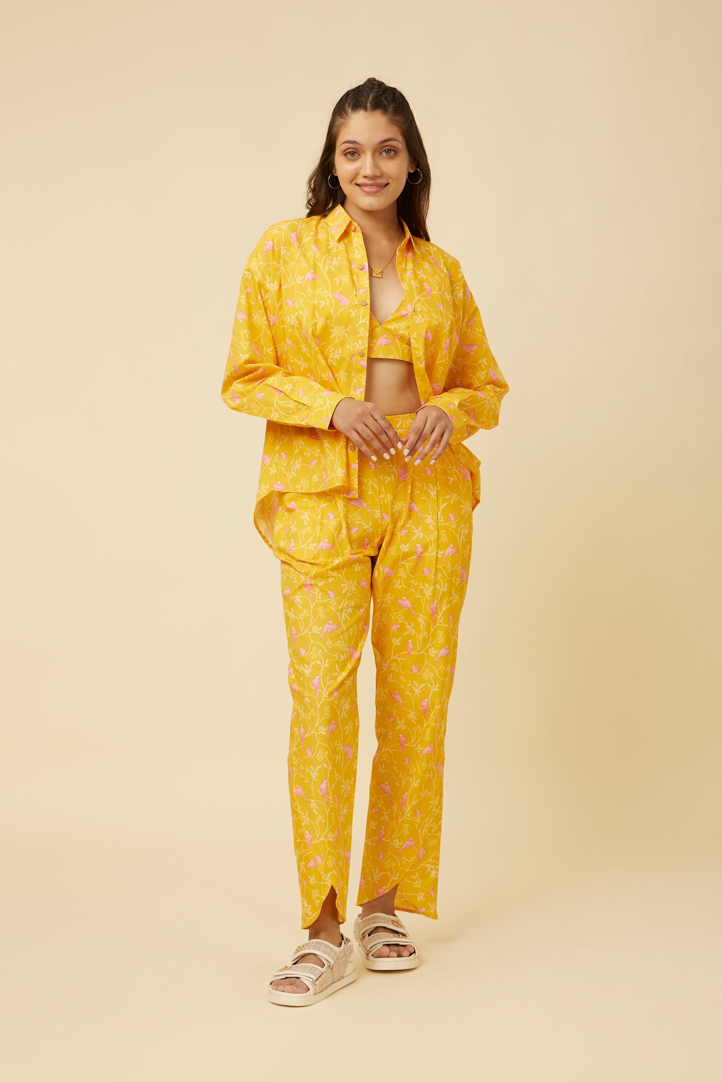 Model wearing the Peela Sunshine Full-Sleeve Shirt, styled untucked over matching pants, giving a relaxed and cheerful vibe, with a bralette peeking through