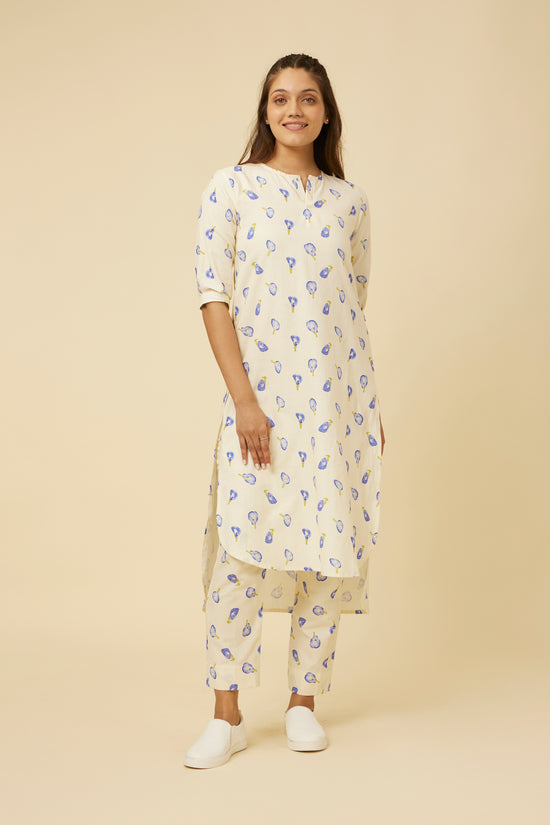 Model elegantly displays the Blue Pea Kurta & Pants Co-Ord Set, combining traditional style with a modern twist, featuring relaxed fit kurta with closed neck, 3/4 sleeves, and a front slit paired with straight pants, ideal for versatile occasions.