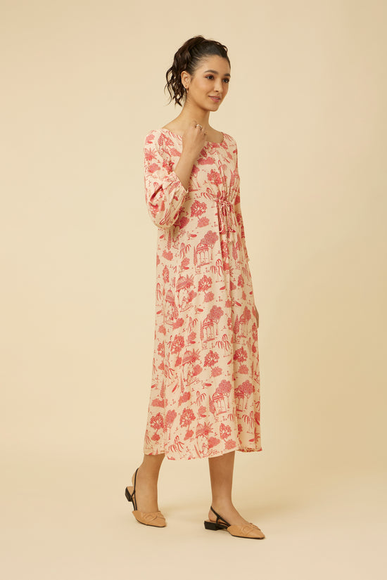 Side angle of pink bhutta printed Jaipur Rani dress with a flattering cinch at the waist and relaxed three-quarter sleeves