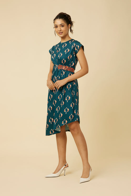 Full-length view of the model wearing the sleeveless Yin Yang Belt Dress with a serene koi fish print and a flowy A-line silhouette