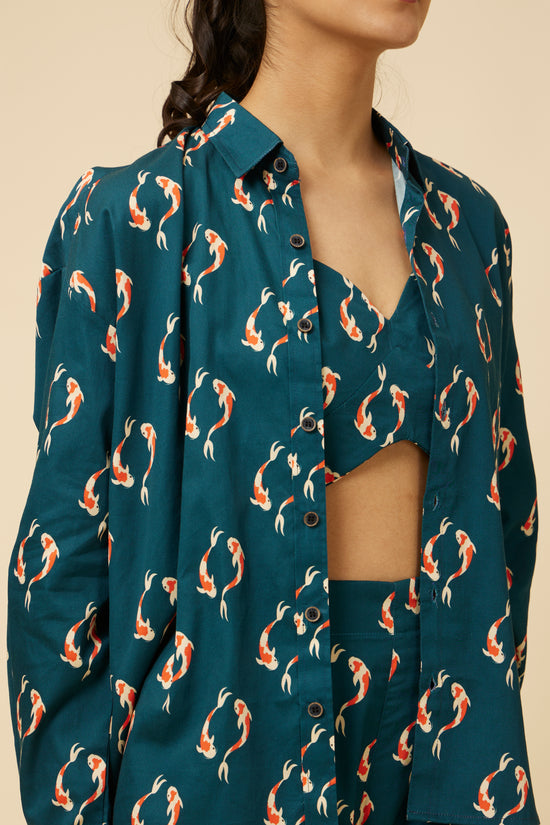Close-up of the Yin Yang Koi Fish Full-Sleeve Shirt in teal with a vibrant orange koi fish print, showcasing the buttoned front and collar